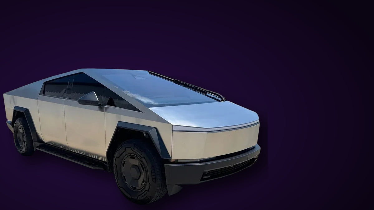 Tesla Cybertruck with a bright stainless steel exoskeleton on a purple background